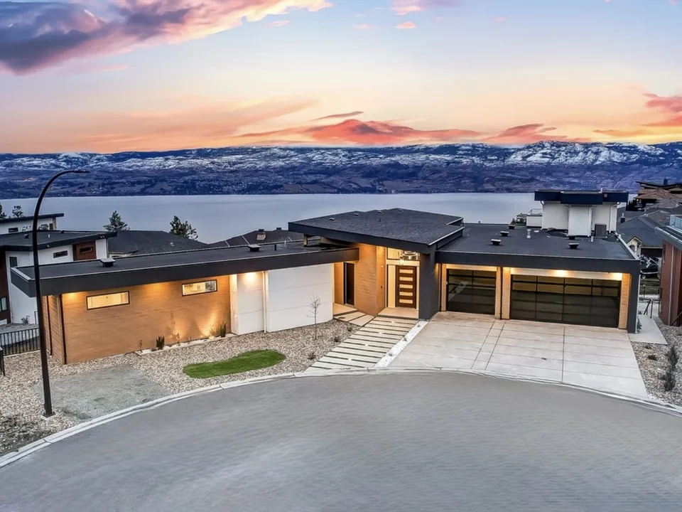 Contemporary Malbec Place home overlooking the Okanagan landscape at sunset